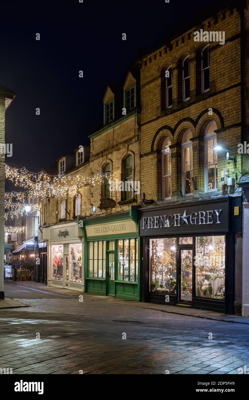 Christmas lights at night along Black Jack Street. Cirencester, Cotswolds, Gloucestershire, England Stock Photo