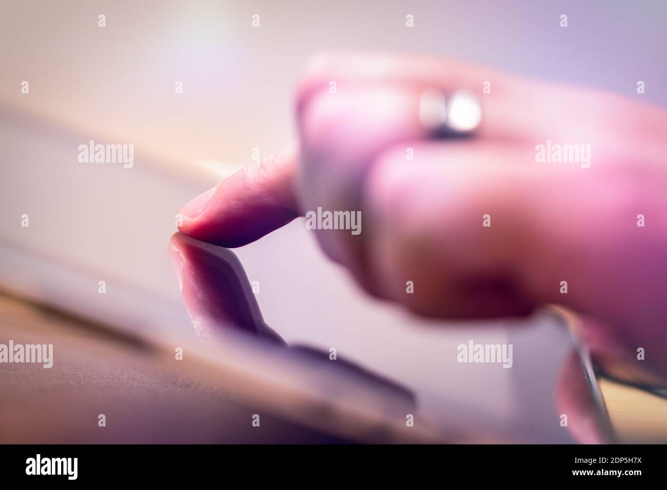 tap with a finger on a tablet, technology Stock Photo