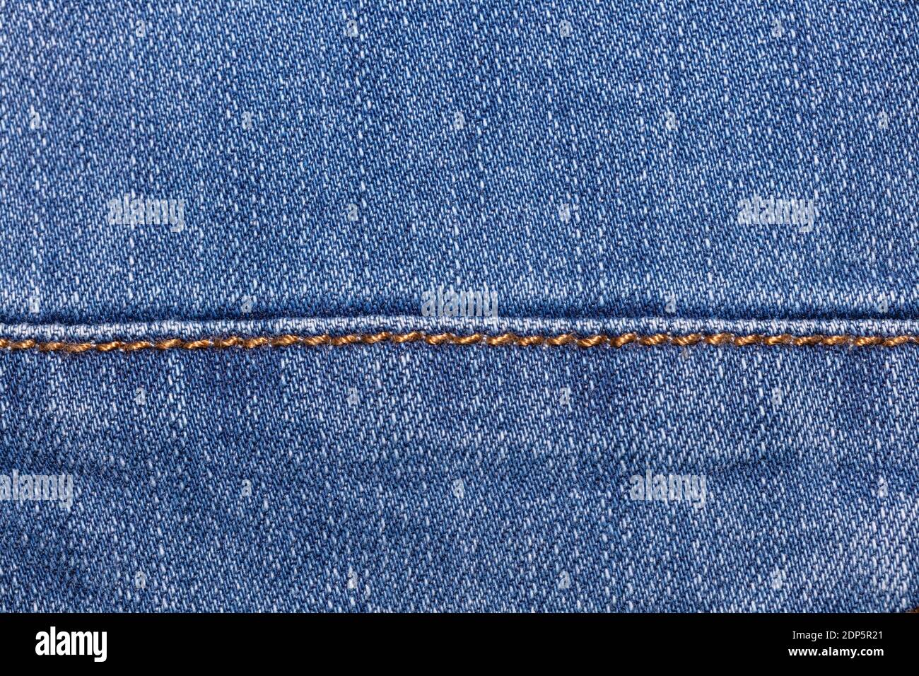 Close-up shot of blue jeans fabric with 