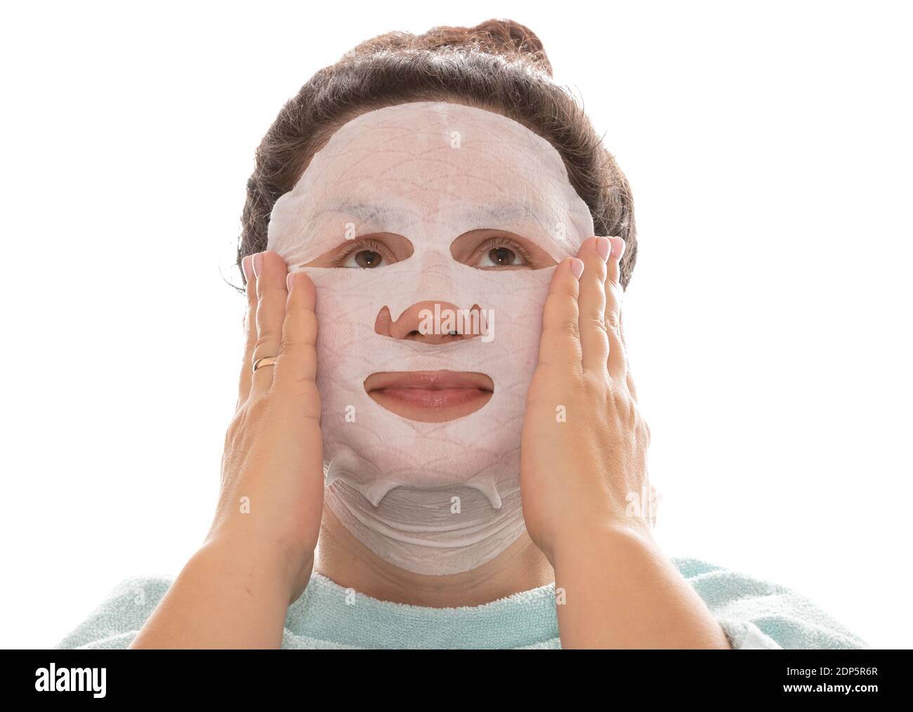 Spa, facial care, and beauty treatments. Woman with a moisturizing mask