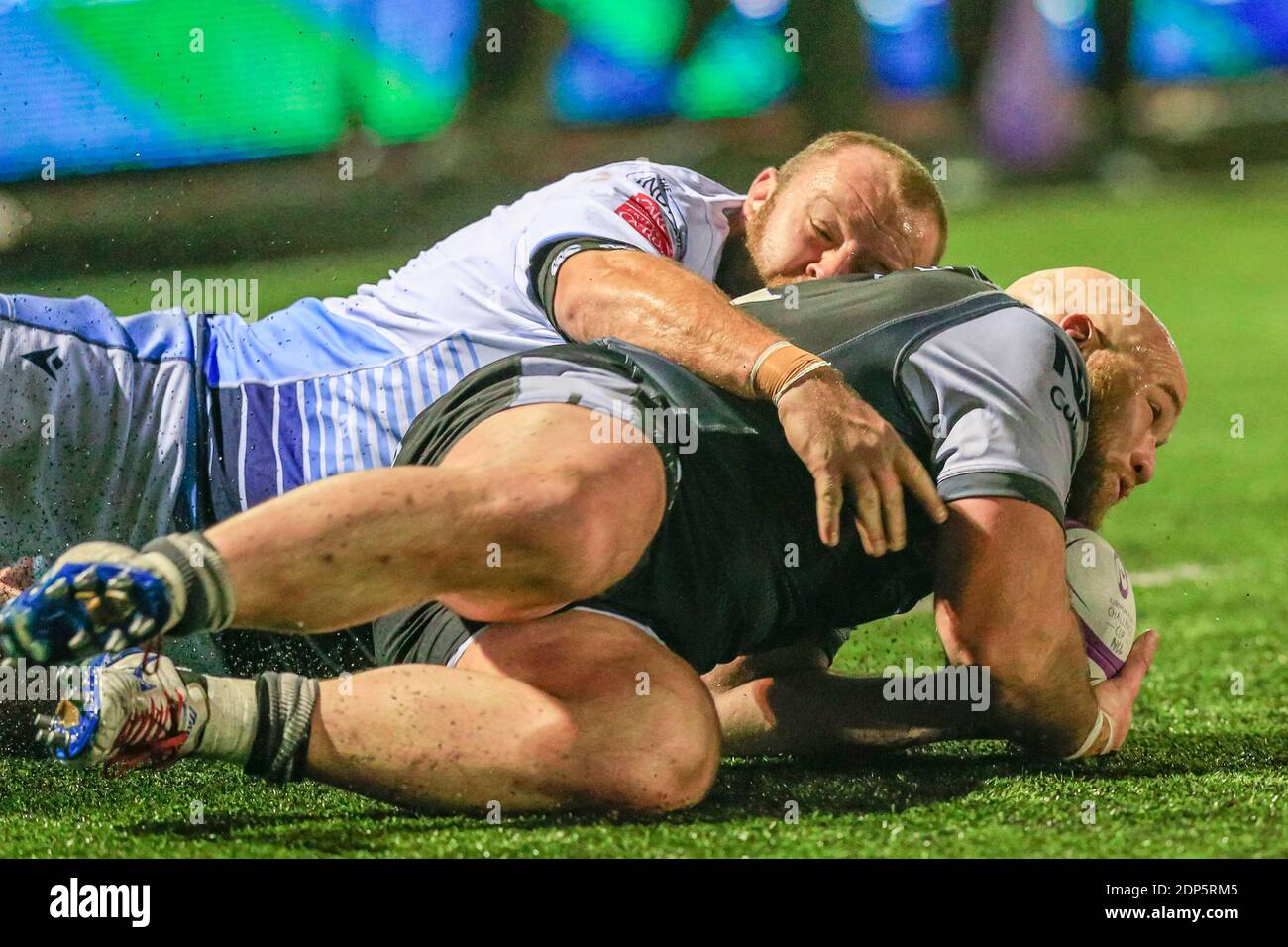 Scott Andrews of Cardiff Blues tackles Kyle Cooper of Newcastle Falcons Stock Photo
