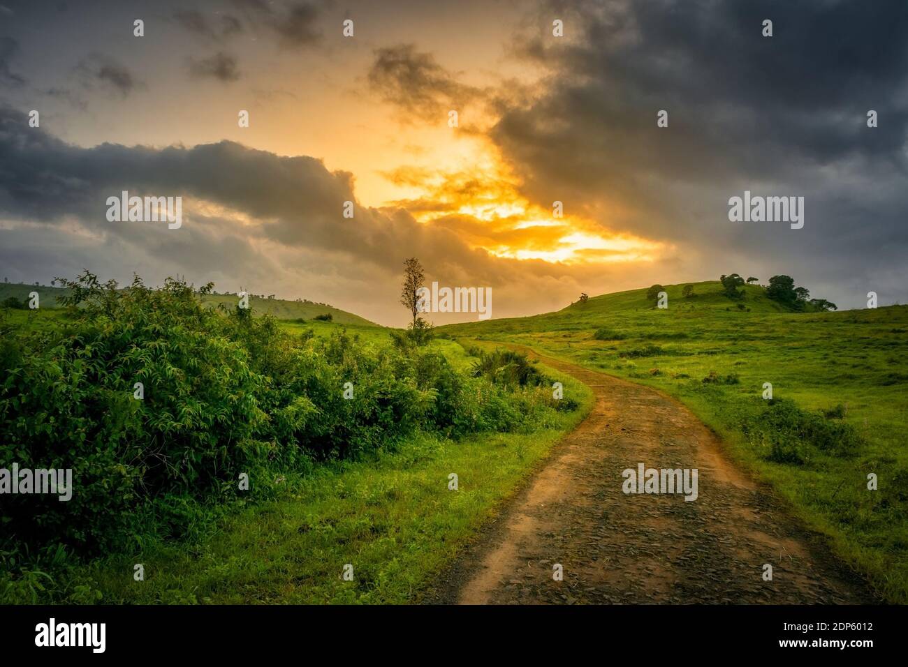 Beautiful Evening and dramatic colors of the cloudy sky with a landscape Stock Photo