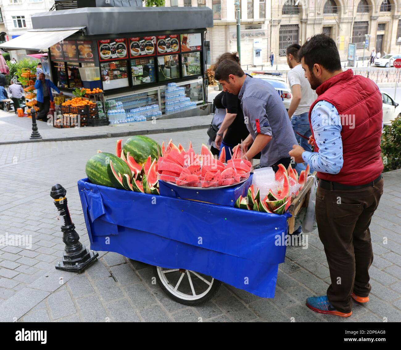 ISTANBUL,TURKEY-JUNE 7:Guys slicing watermelon to sell at their