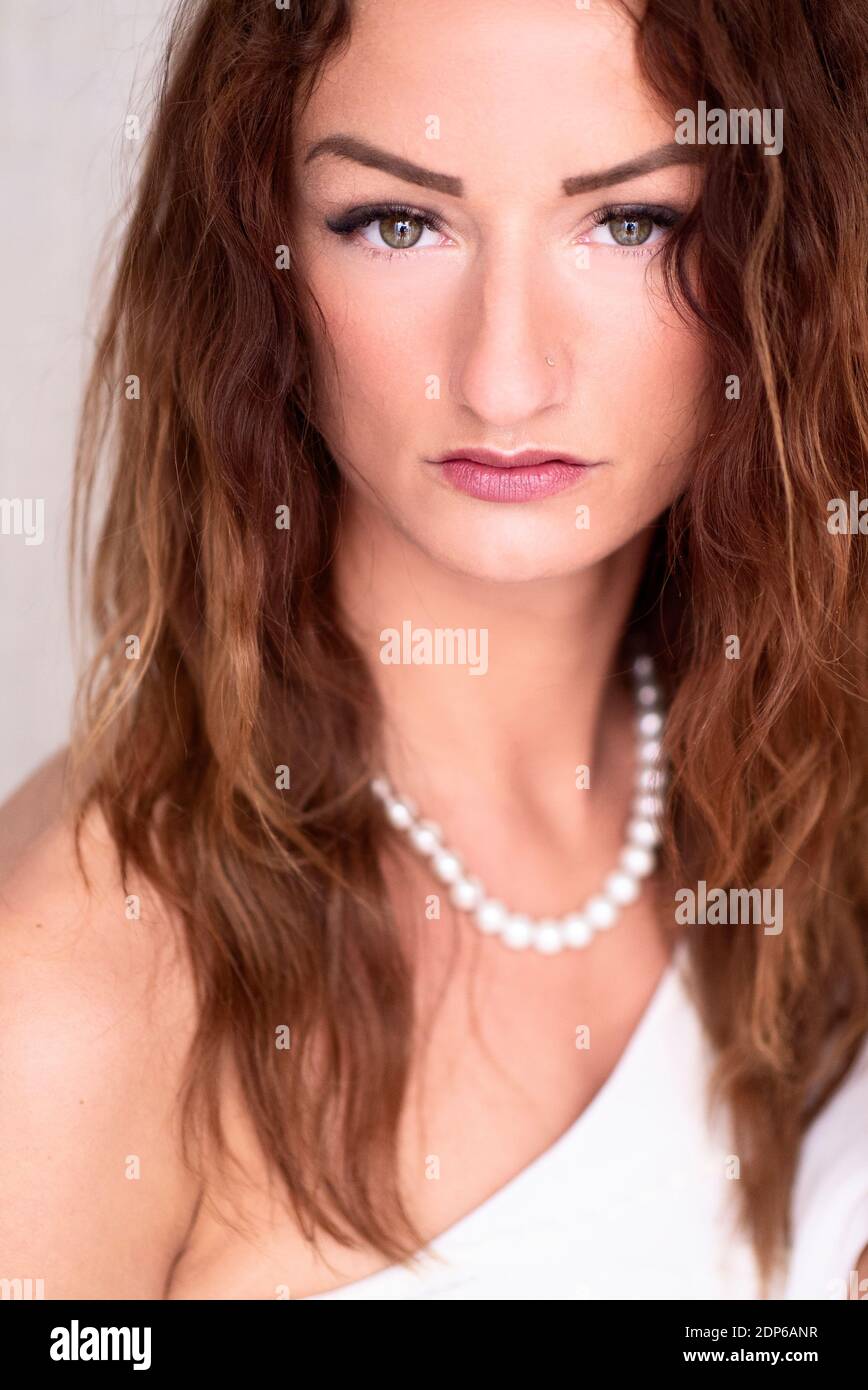 Beautiful woman wearing pearl necklace Stock Photo