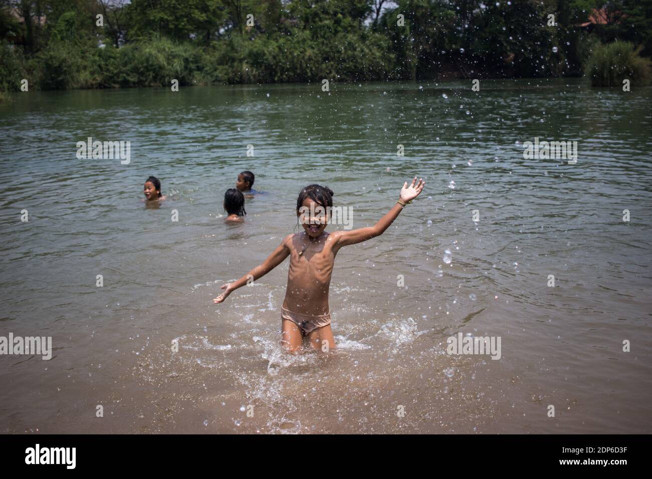 bathing children laos Lao Children playing in the water, Next to Van Vieng, Laos Stock Photo -  Alamy