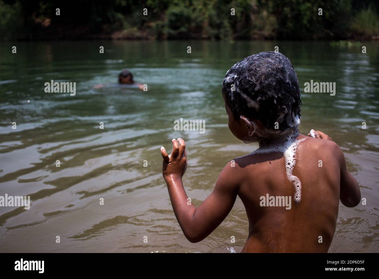 Lao children playing in river hi-res stock photography and images - Alamy