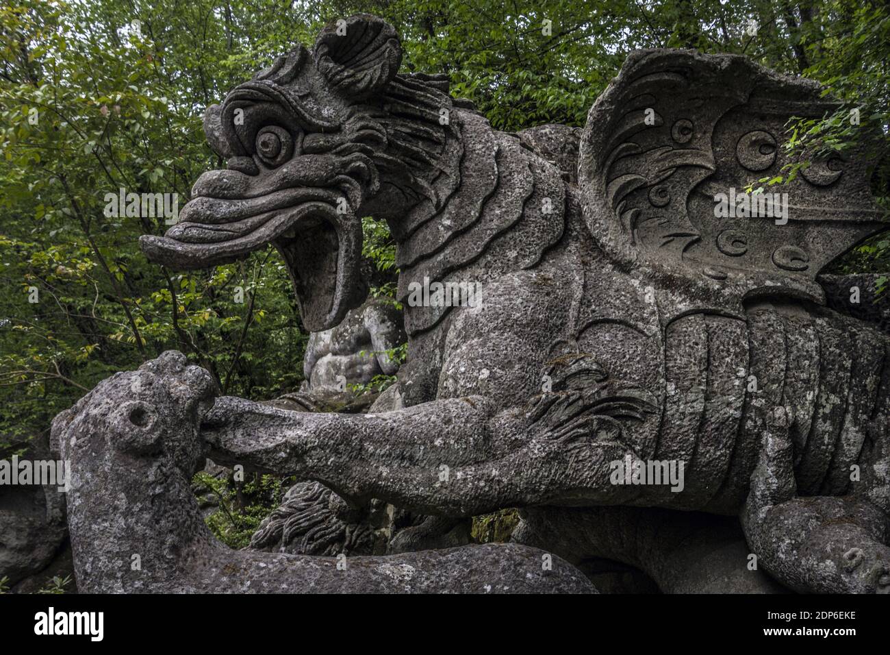 The large statue of the Dragon bitten by a lion and a wolf at the famous Gardens of Bomarzo, Viterbo Stock Photo