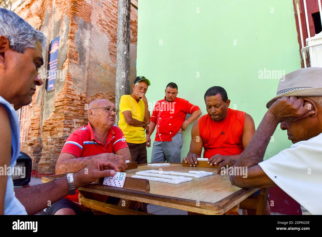 Cuban men playing dominoes on the street, Trinidad Cuba Stock Photo