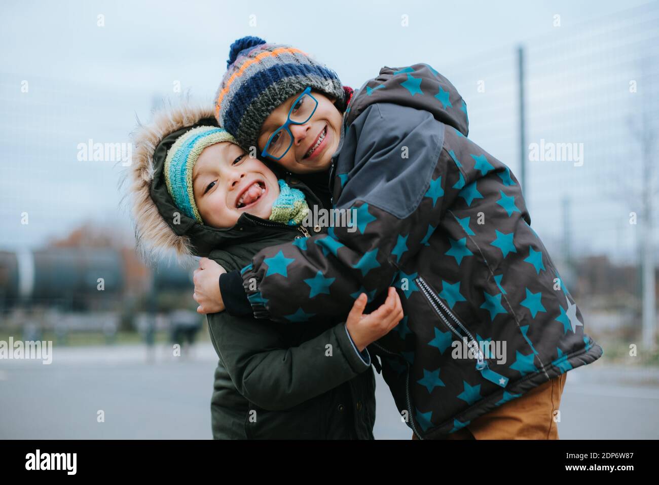 two young brothers give each other a hug Stock Photo - Alamy