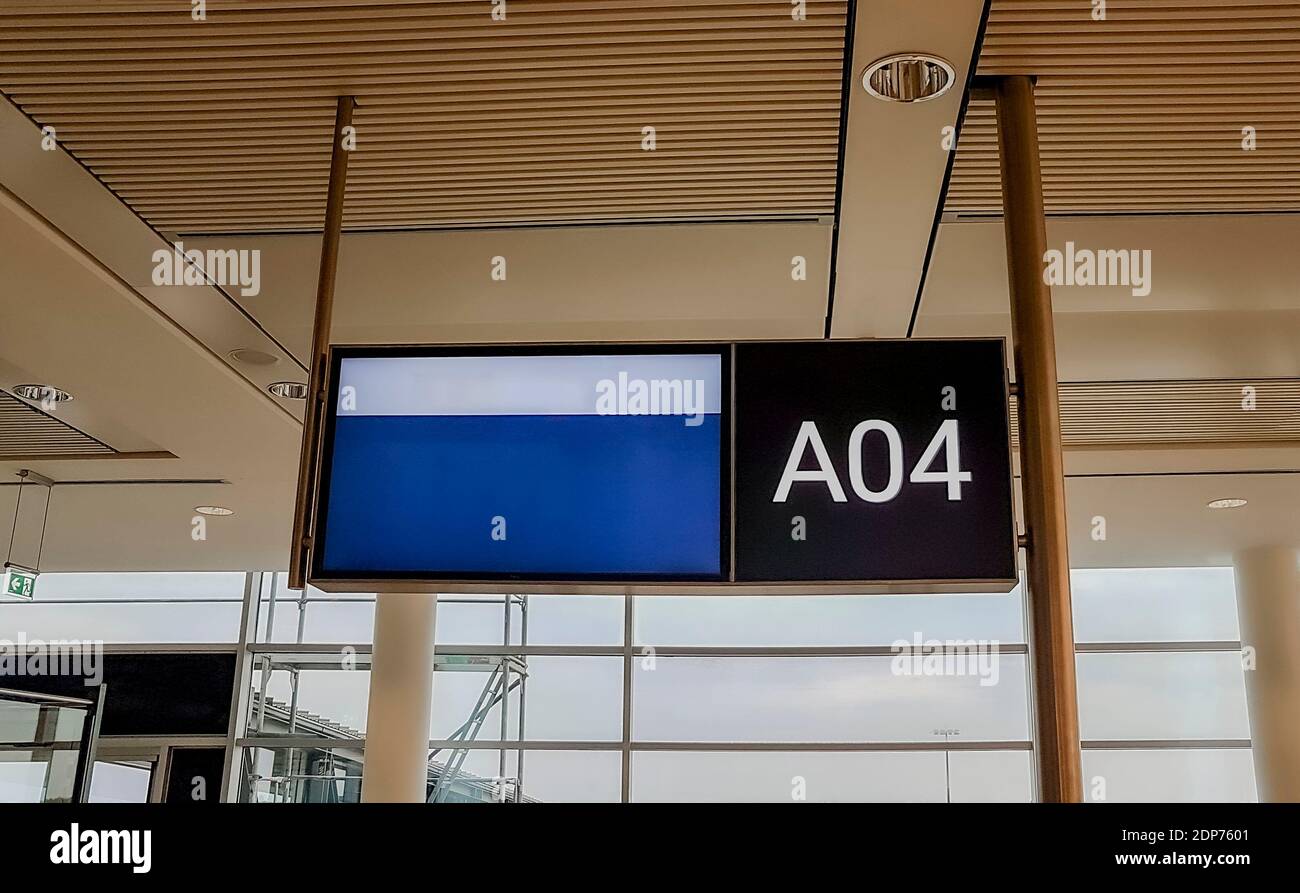 Blue and white timetable for boarding and flight in Airport Bremen in