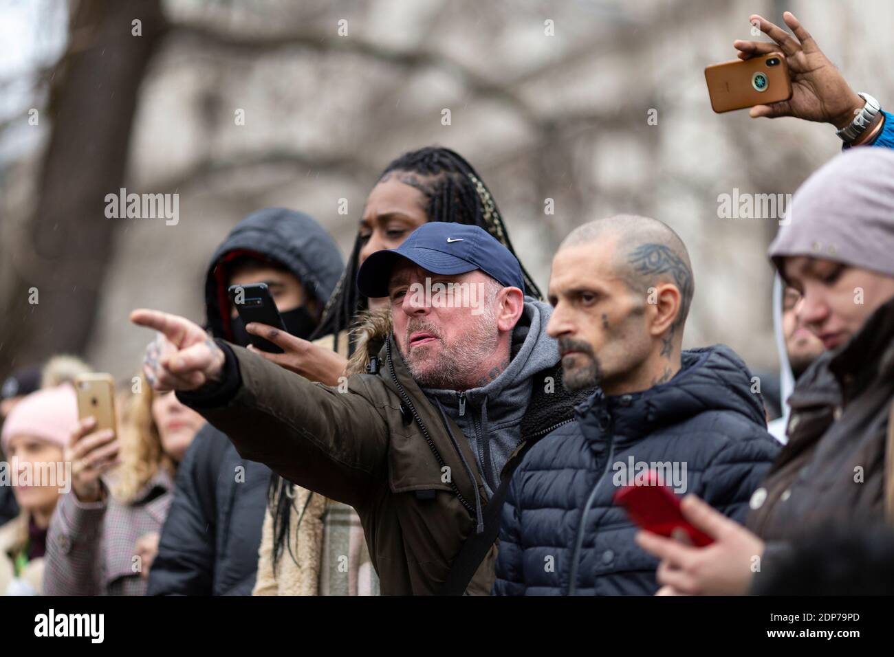 An angry protester shouts at police during COVID-19 anti-vaccine protest, Parliament Square, London, 14 December 2020 Stock Photo