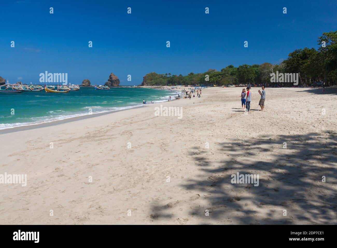 The tourists on Papuma beach, Jember. Stock Photo