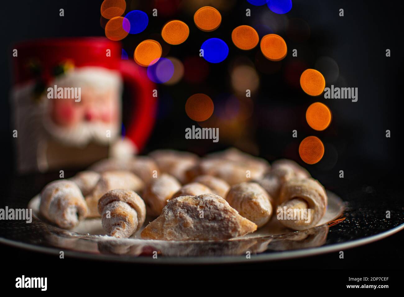 Traditional Christmas dinner dessert next to a mug with milk and bokeh