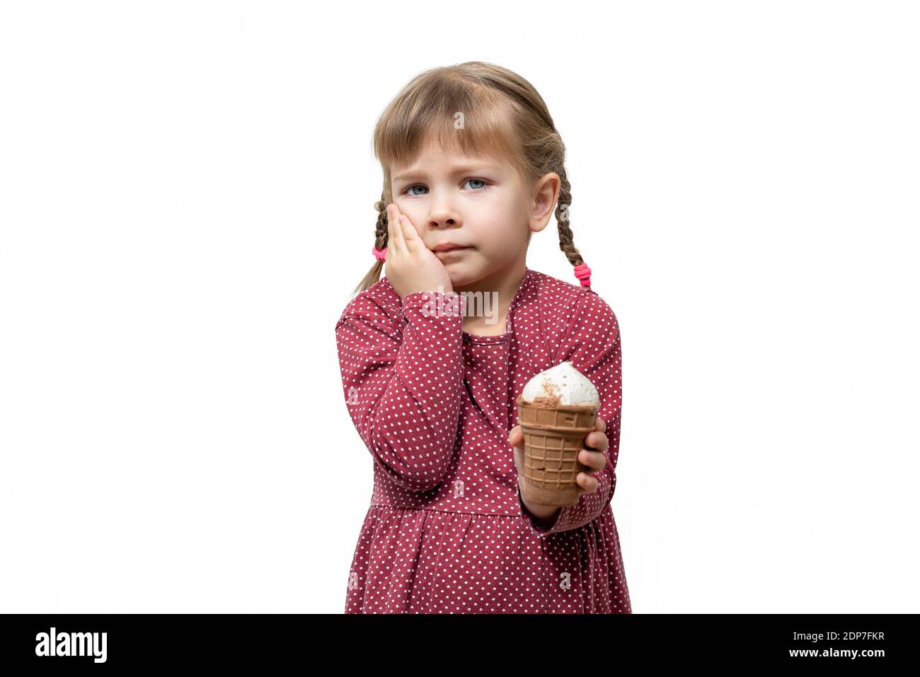 child has a toothache while eating ice cream. sensitivity of teeth to
