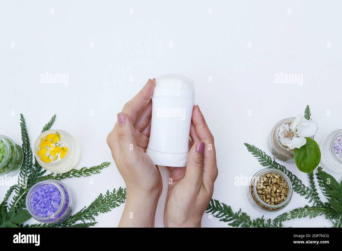 Hand holding deodorant antiperspirant fragrance flower , health care