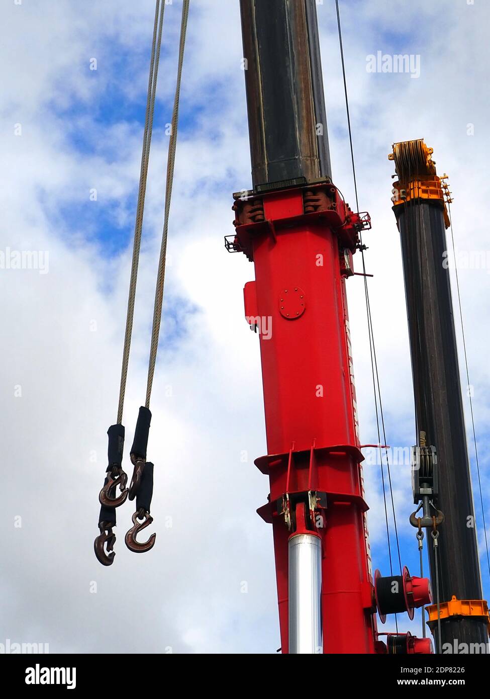 Detail of a red and a black heavy-lift crane boom Stock Photo