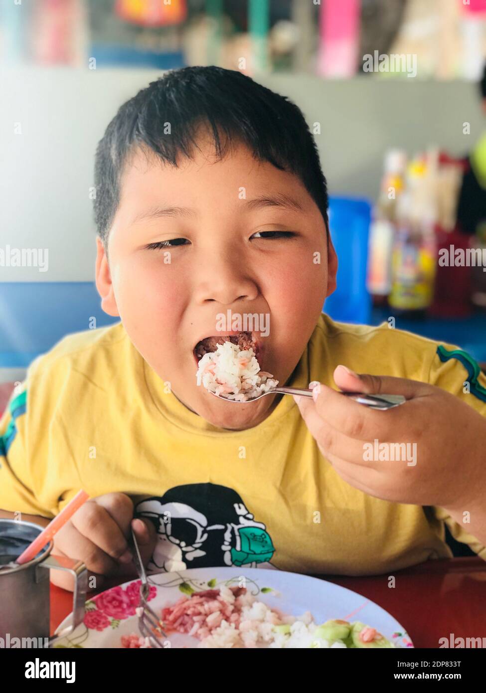 Close-up Of Boy Eating Rice Stock Photo - Alamy