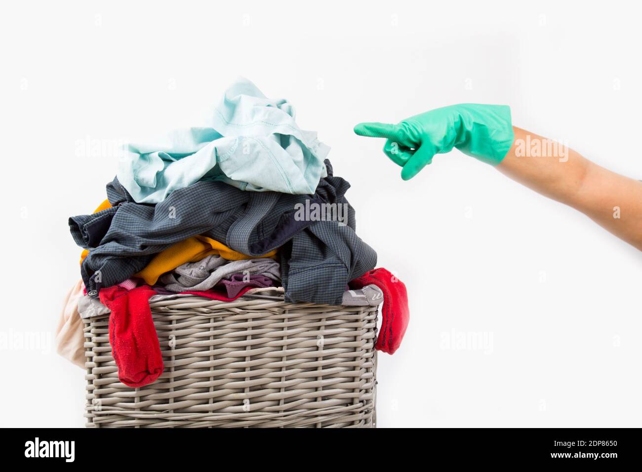 dirty laundry waiting to be washed in the laundry basket Stock Photo