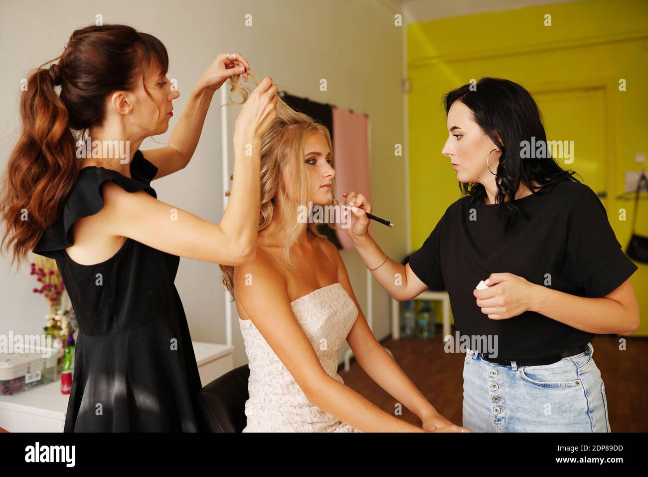 Backstage prepare young beautiful modeling stylist hairdresser and
