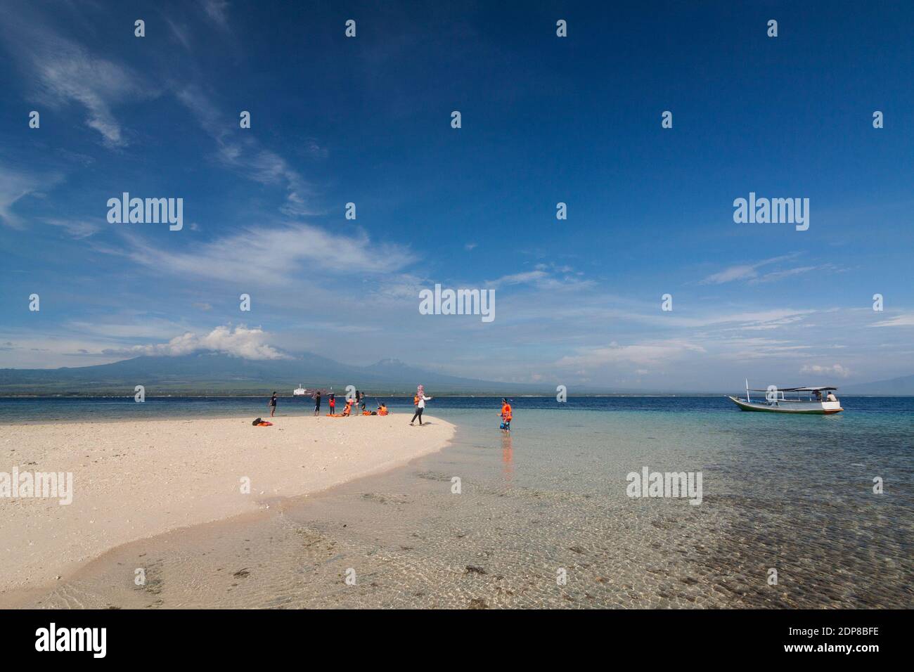 The tourists arrive at Tabuhan Island, one of the marine tourism destinations in Banyuwangi district. Stock Photo