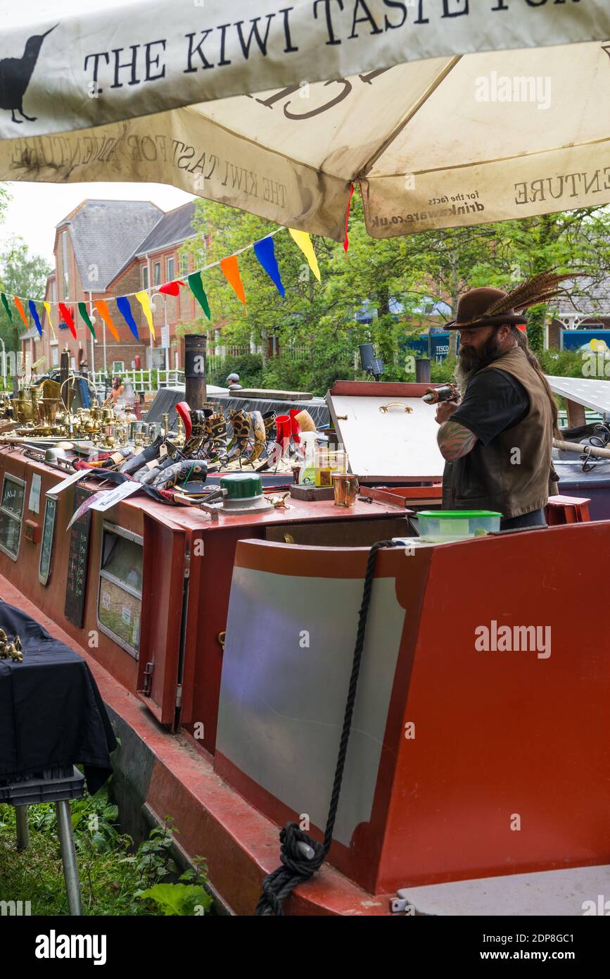 Rickmansworth Festival. A man selling craft items from his narrow boat