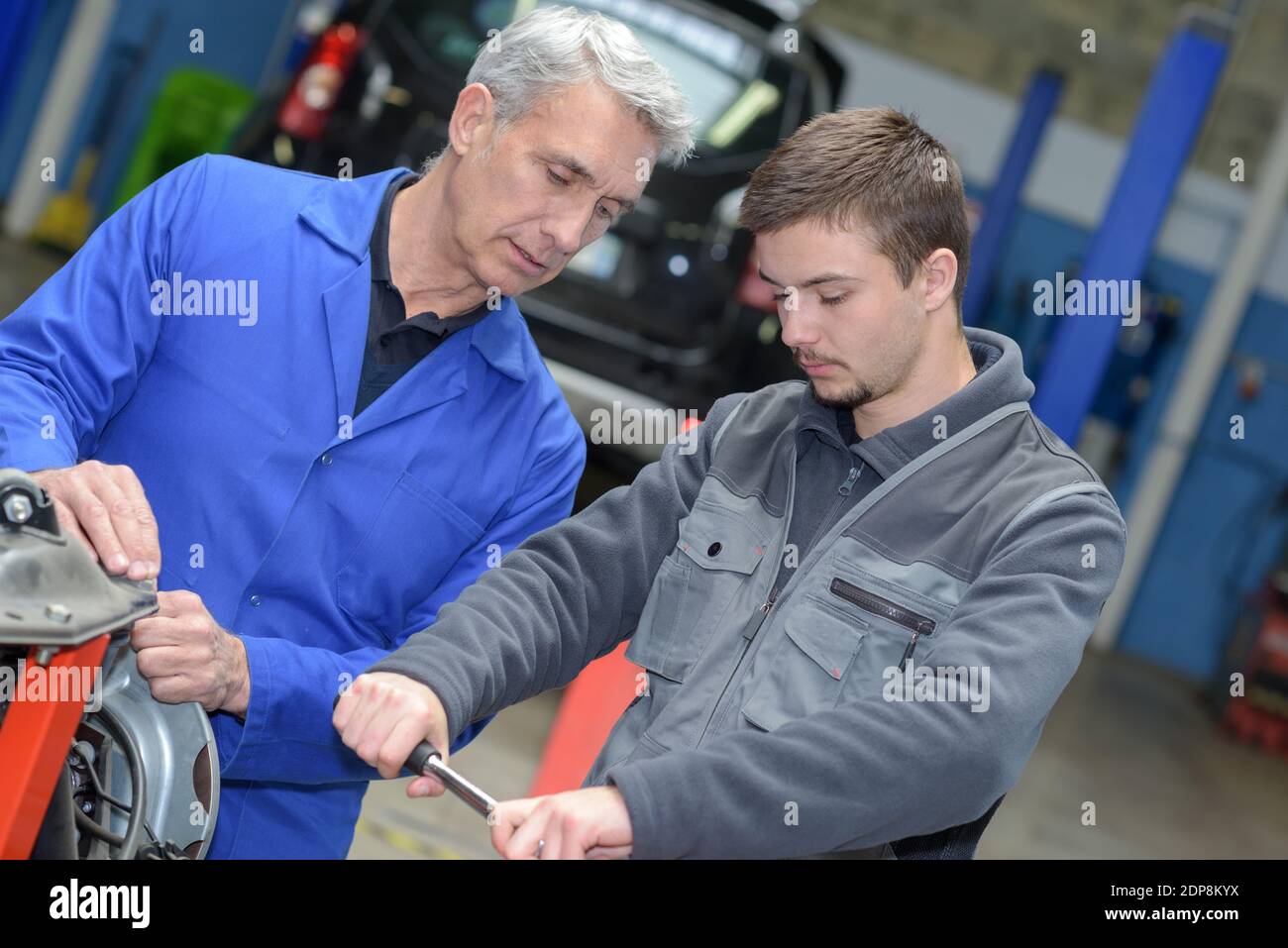 Male mechanic leaning engine hi-res stock photography and images - Alamy