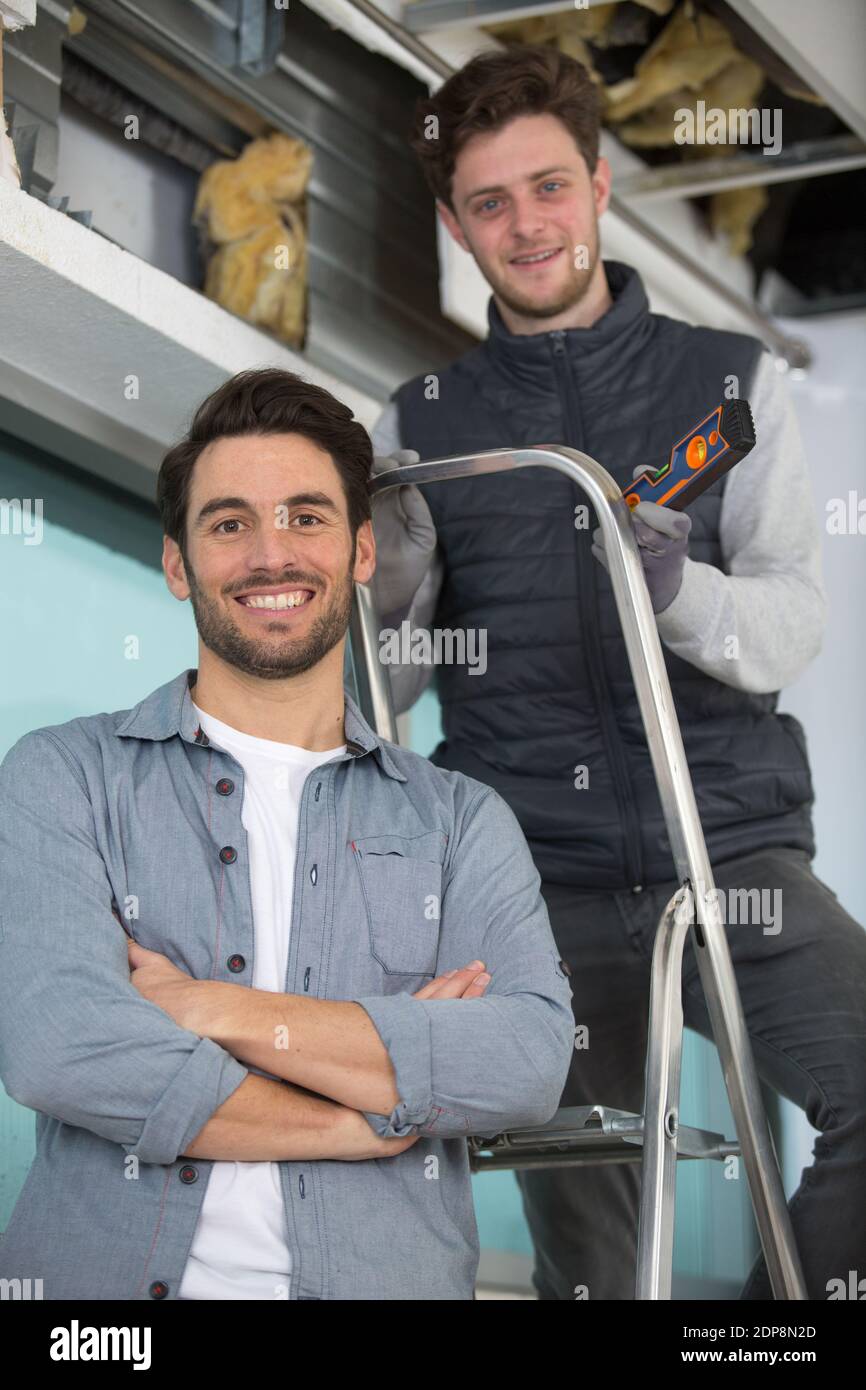 Two construction workers fixing hi-res stock photography and images - Alamy