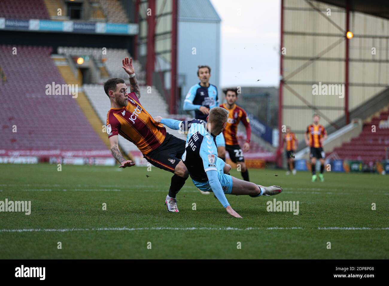 BRADFORD, ENGLAND. DECEMBER 19TH A collission between Bradford City's Harry Pritchard (7) and Cambridge FC's Harry Darling (6) during the Sky Bet League 2 match between Bradford City and Cambridge United at the Coral Windows Stadium, Bradford on Saturday 19th December 2020. (Credit: Emily Moorby | MI News ) Credit: MI News & Sport /Alamy Live News Stock Photo