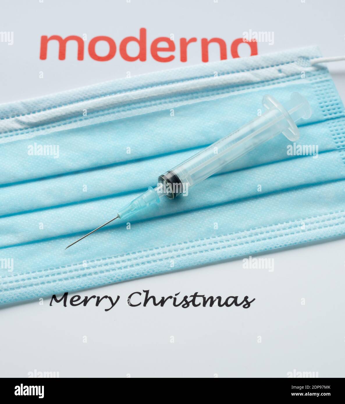 Moderna logo with a syringe and a face mask and the text merry christmas, Denmark, December 19, 2020 Stock Photo