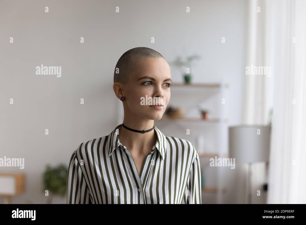 Thoughtful millennial woman with short hair represent non formal subculture Stock Photo