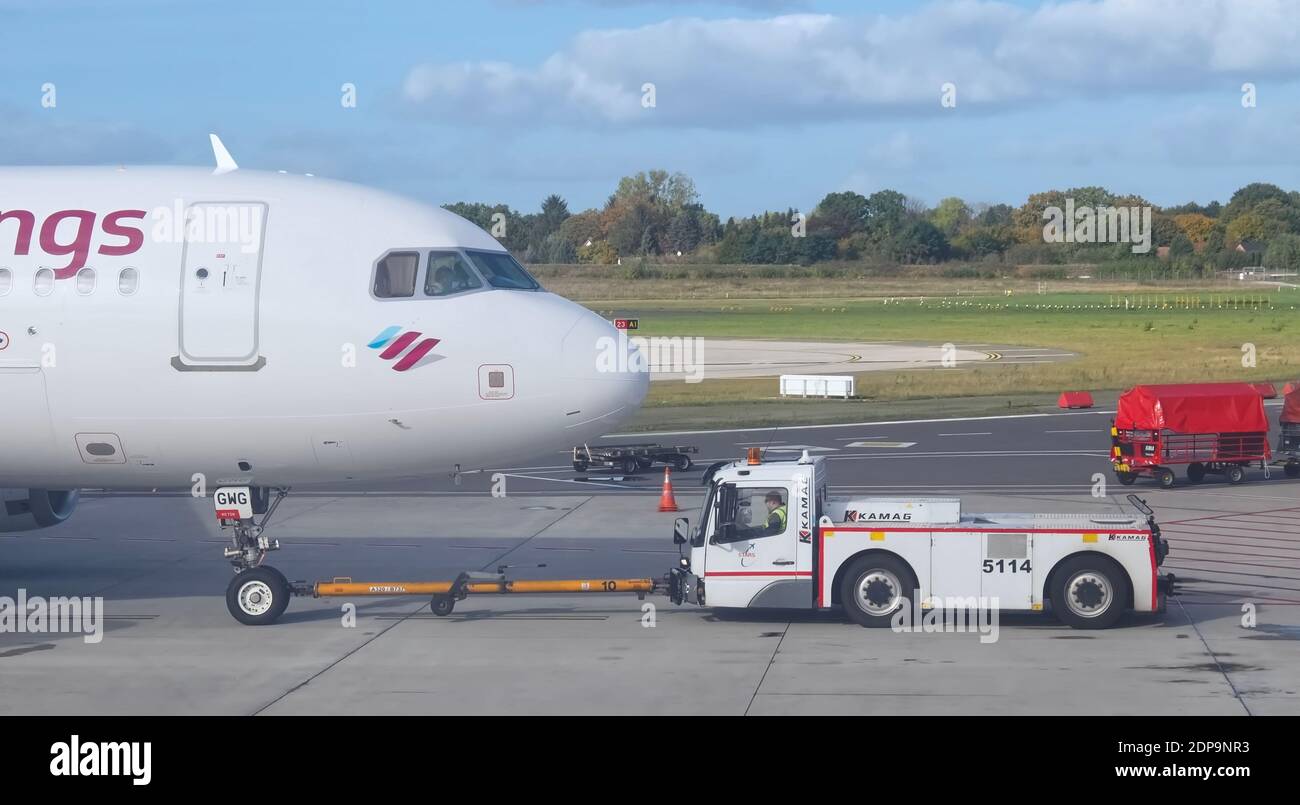 Eurowings airplane at Faro airport is towed onto the tarmac Stock Photo
