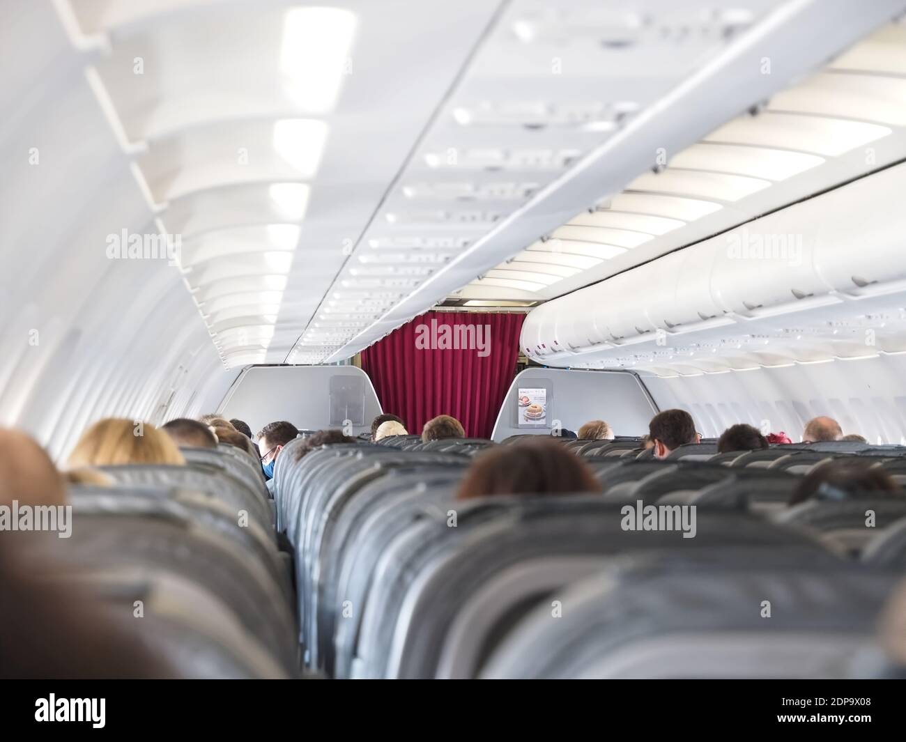 The world of aircraft - Passengers inside the cabin of an airplane Stock Photo