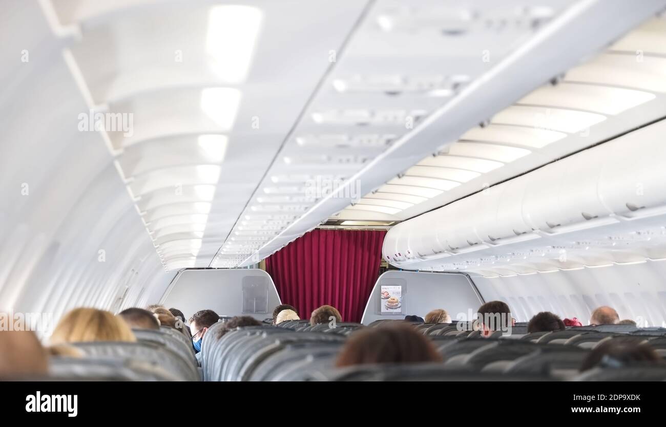The world of aircraft - Passengers inside the cabin of an airplane Stock Photo
