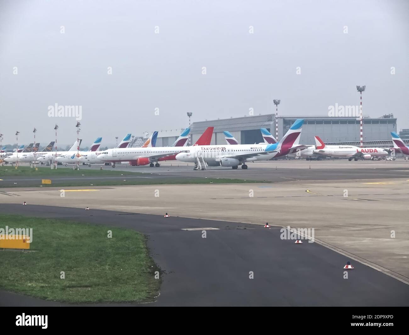Row of Eurowings airplanes at Duesseldorf airport in park position during Covid-19 pandemic Stock Photo