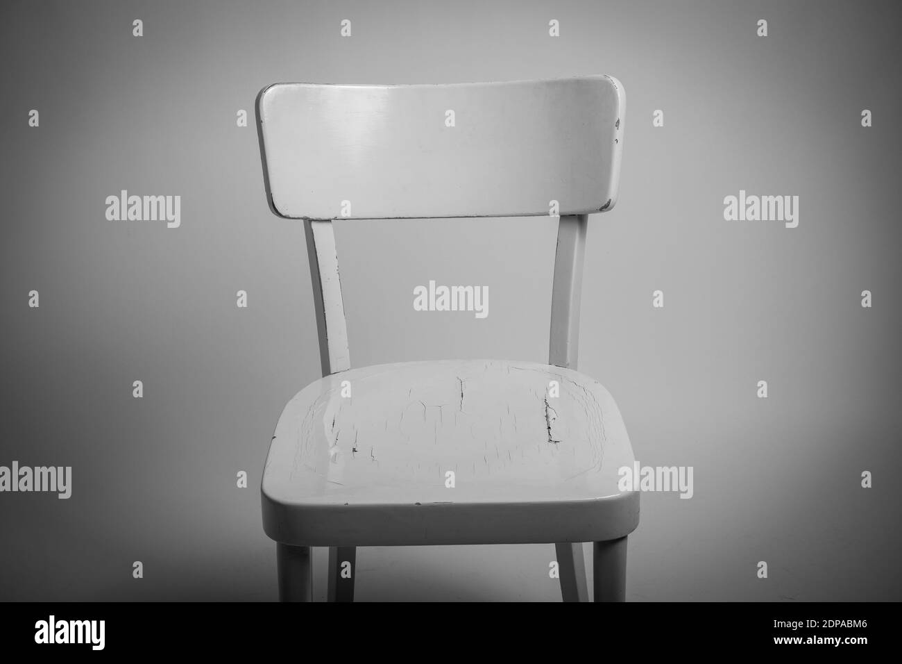 Closeup Of Empty Chair Against Wall Stock Photo Alamy