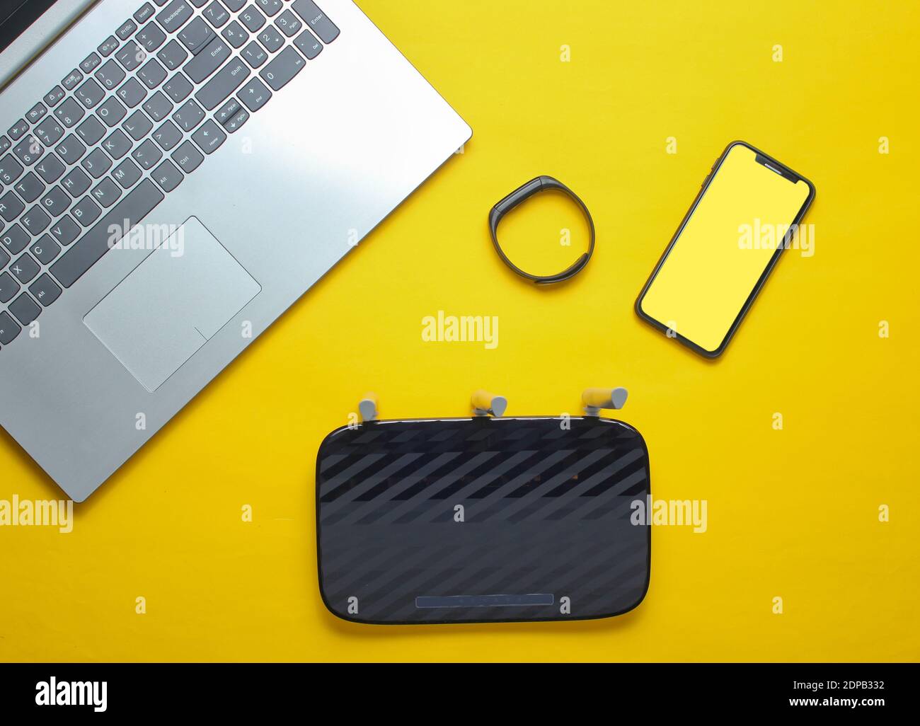 Laptop, wifi router, smartphone, smart tracker, on yellow background
