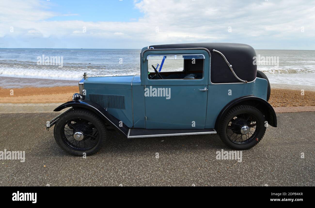 Vintage Blue Austin Seven Parked on Seafront Promenade. Stock Photo