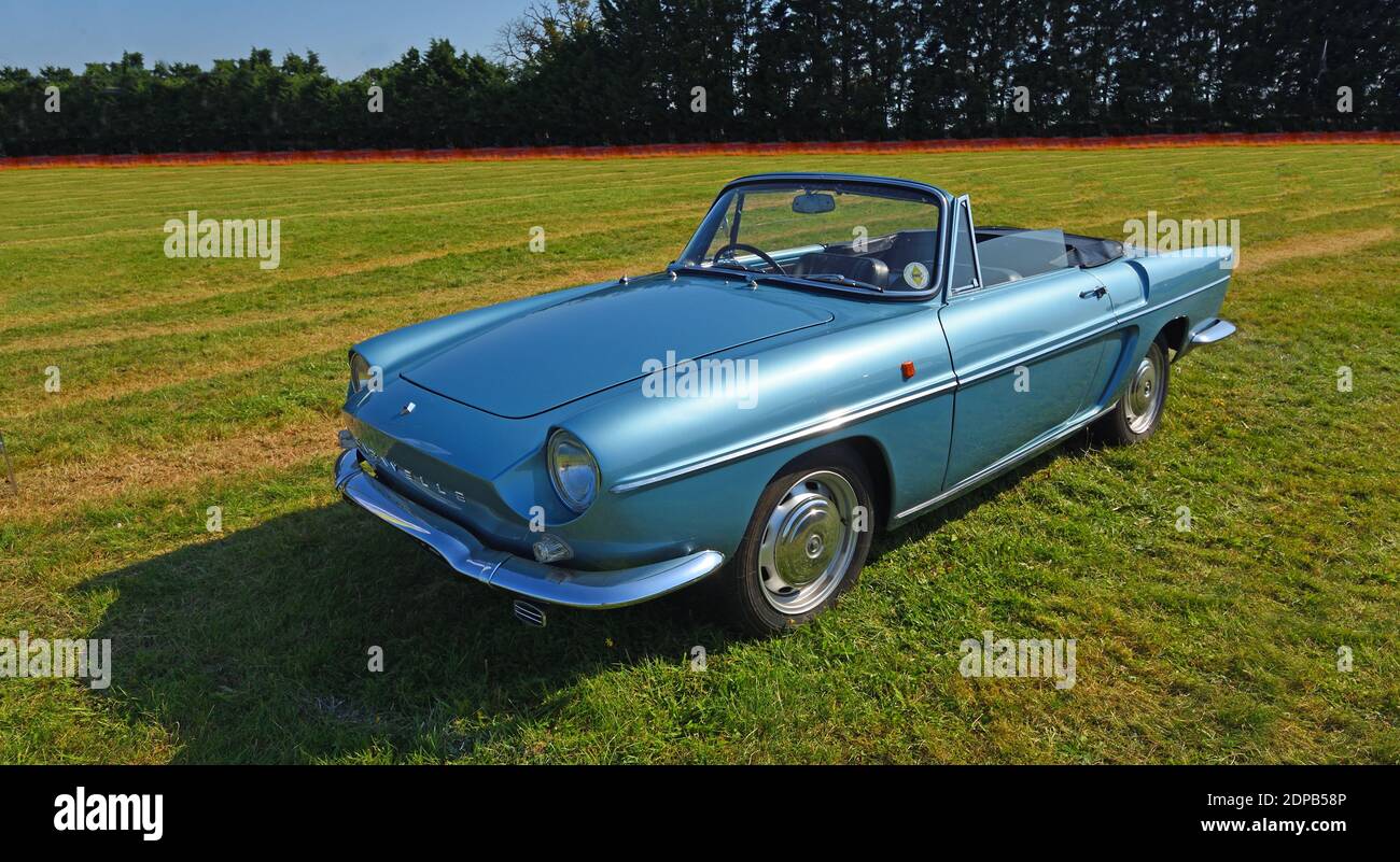 Classic metallic Blue Renault Caravelle Convertible parked in field Stock Photo
