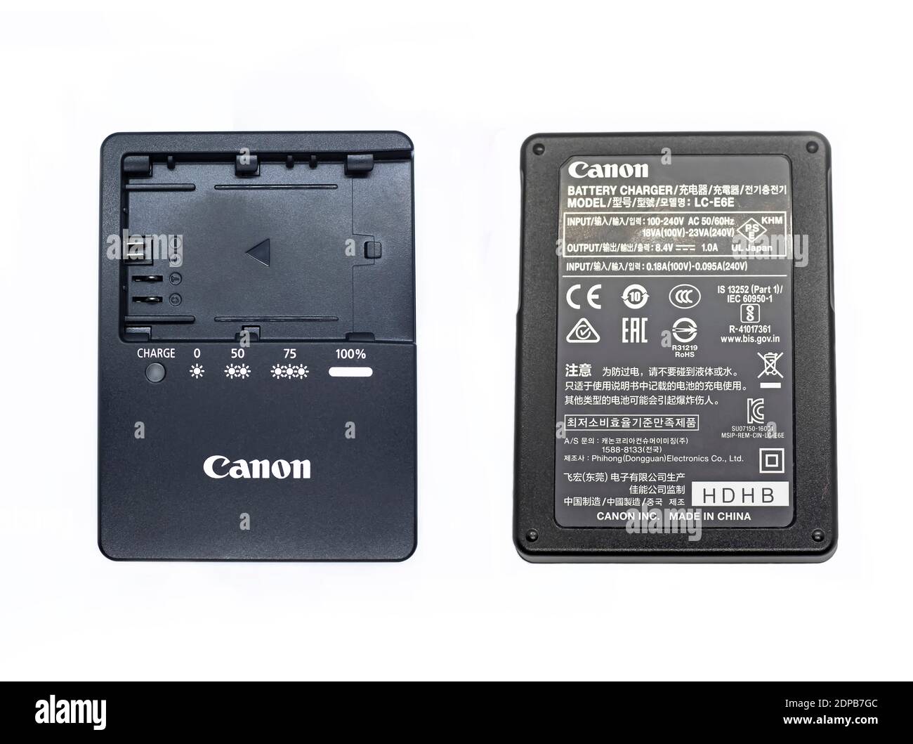 The front and back of the Canon EOS 5D mark iv battery charger isolated on  white backgrounds Stock Photo - Alamy
