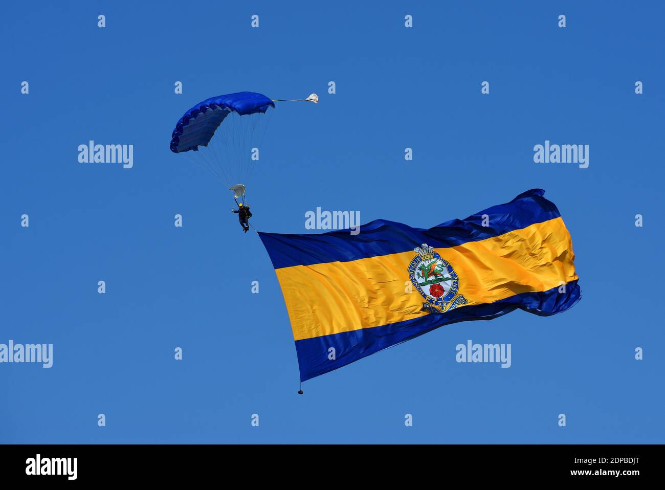 British Army Tigers Freefall Army Parachute Display Team with giant regimental flag. Stock Photo