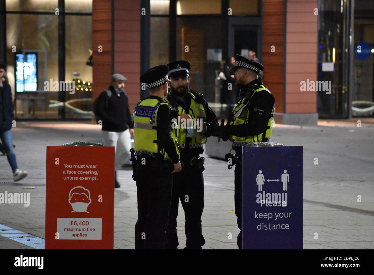 British Transport Police standing outside Reading train station on duty during COVID-19 Stock Photo