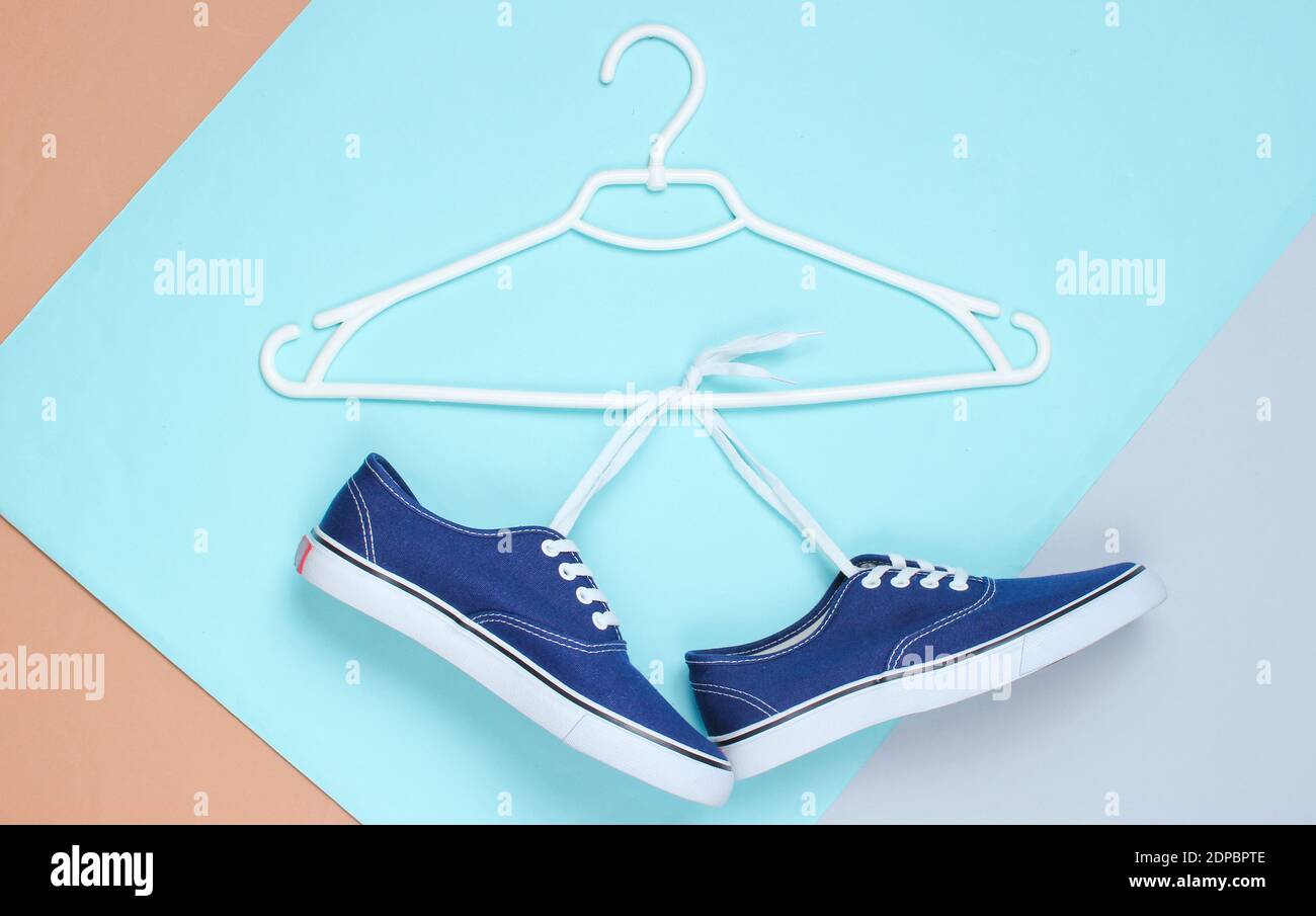 Flat Lay of Modern Blue Sneakers Shoes With Hanger On Pastel Background ...