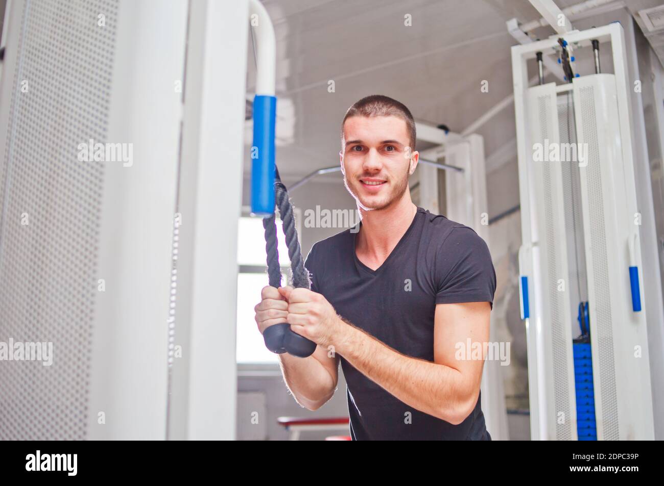 Tricep pull down machine hires stock photography and images Alamy