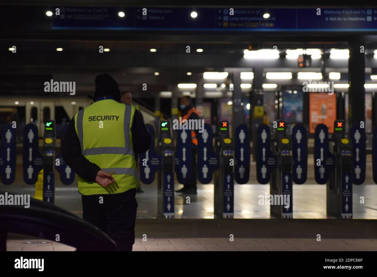 Security guard stands outside Reading train station on duty during COVID-19 pandemic. Stock Photo