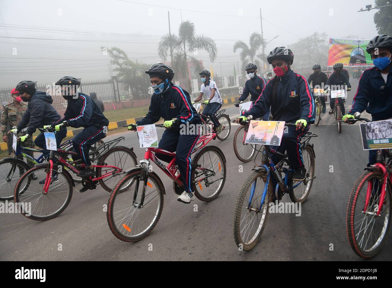 NCC cadets are cycling on the occasion of 50th Anniversary of Vijay Diwas, in Agartala. Vijay Diwas is commemorated on 16th December in Bangladesh, to observe Indian military victory over Pakistan in the war of 1971 for the liberation of Bangladesh from Pakistan. Agartala, Tripura, India. Stock Photo