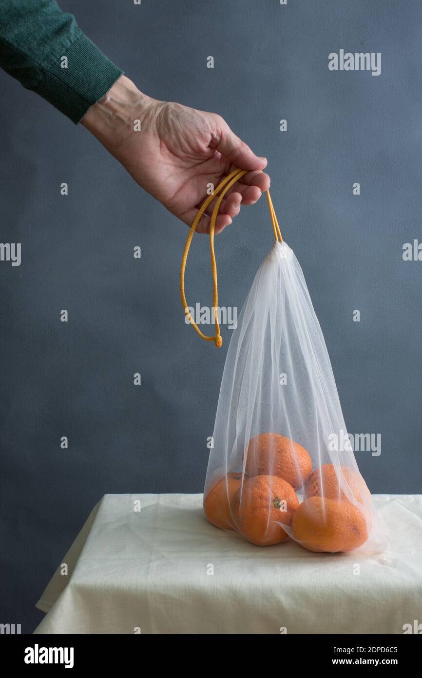 Hand holding bag hi-res stock photography and images - Alamy