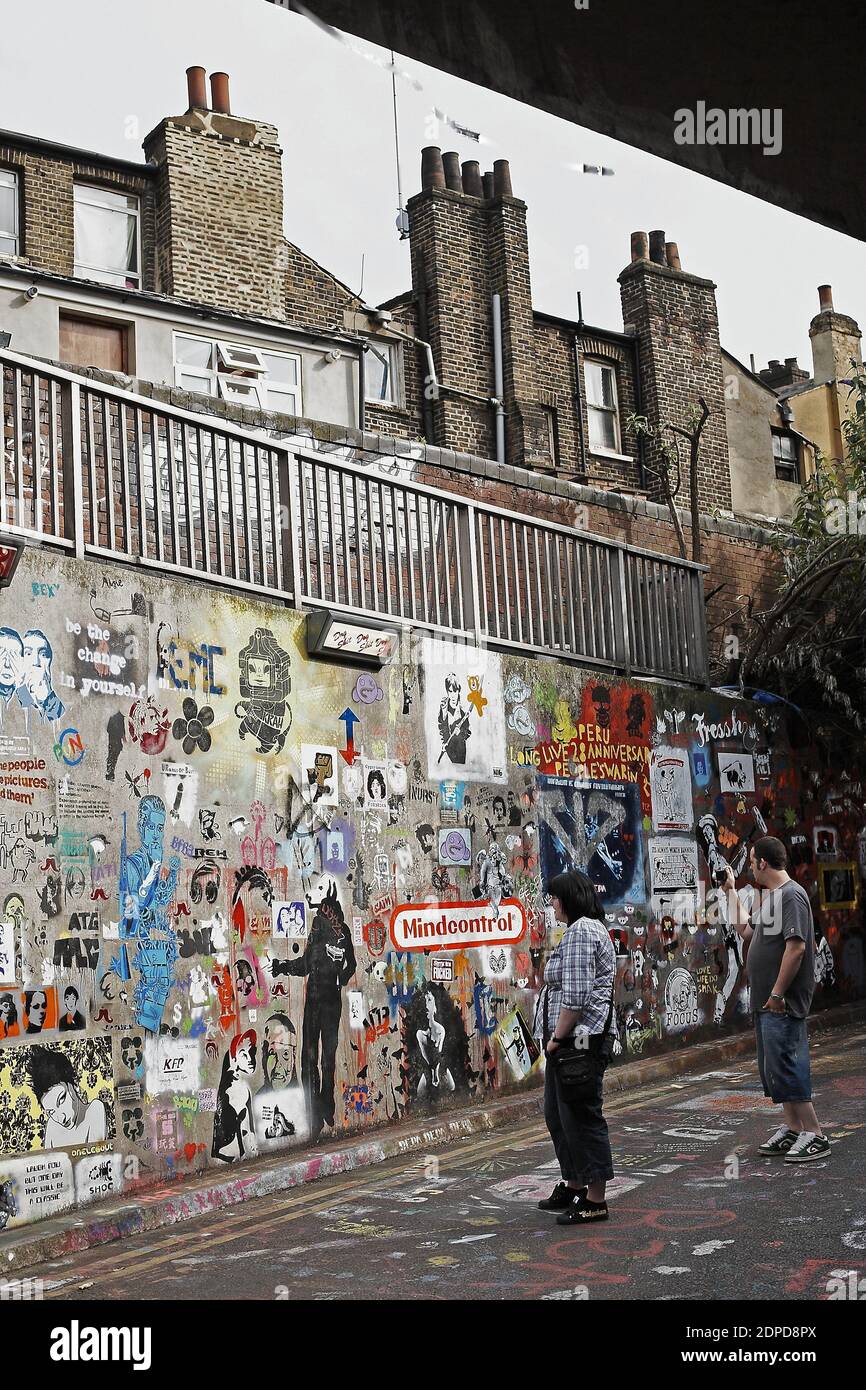GREAT BRITAIN / London/ Street Art /People look at graffiti artwork in a graffiti exhibition in London,  British artist Banksy and other graffiti arti Stock Photo