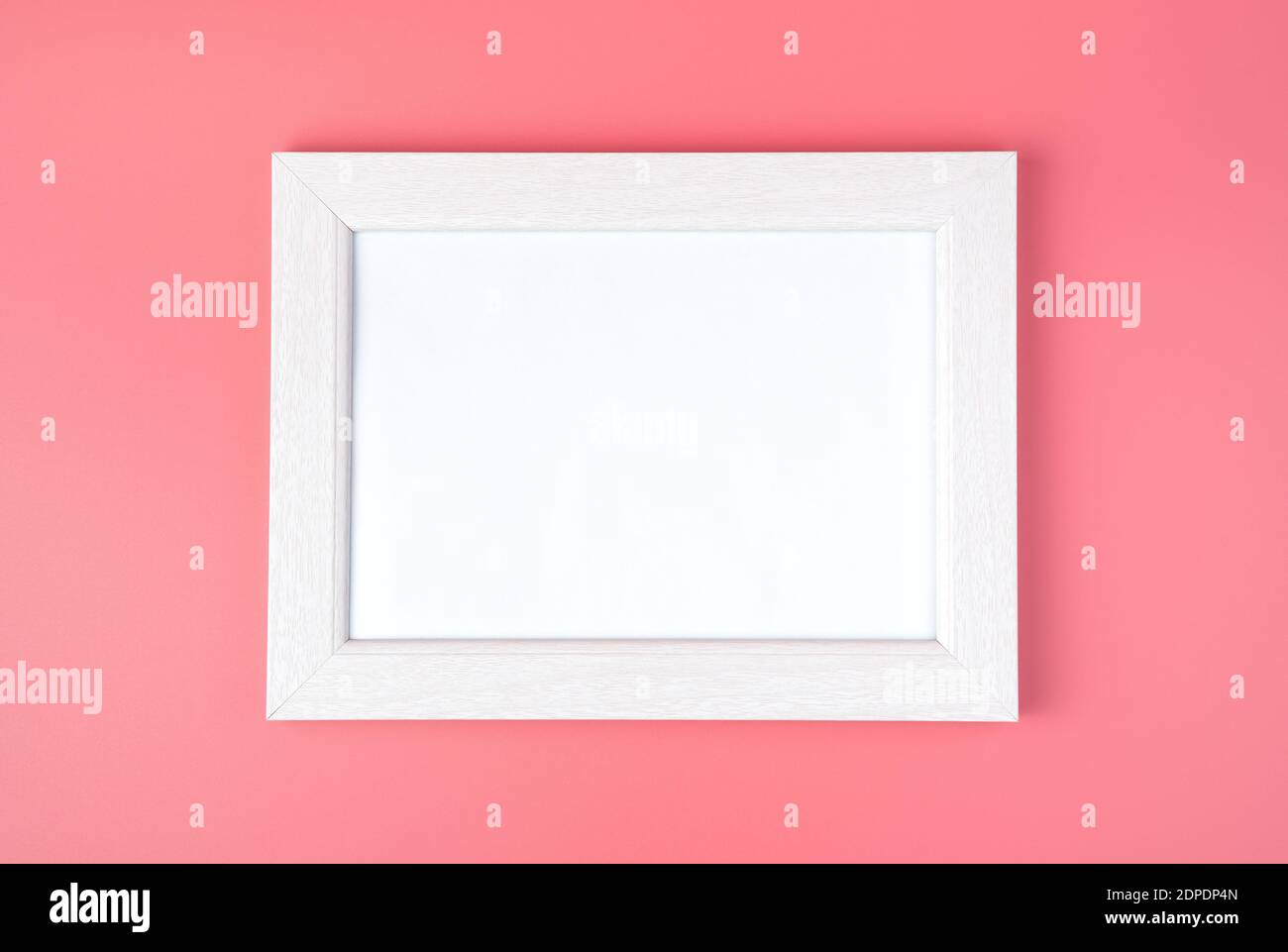 White frame with space to copy, on a pink background. Stock Photo