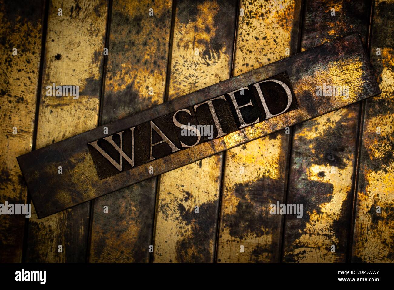 Wasted text on grunge textured copper and gold background Stock Photo