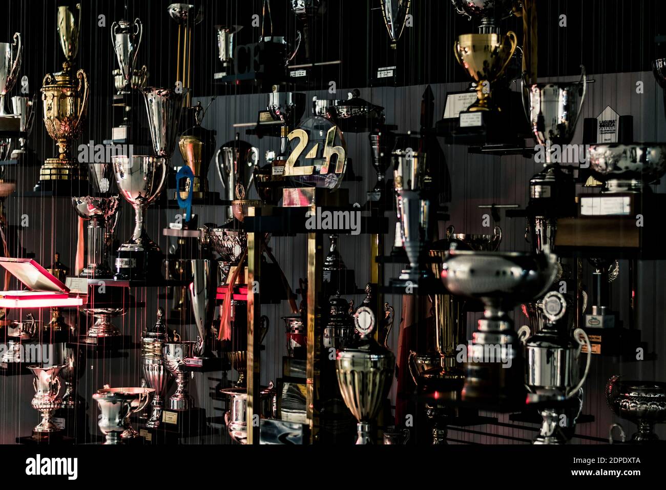 STUTTGART, Germany 6 March 2020: Champions Cups at The Porsche Museum. In the center a Le Mans 24 hours Race Cup can be seen. Stock Photo